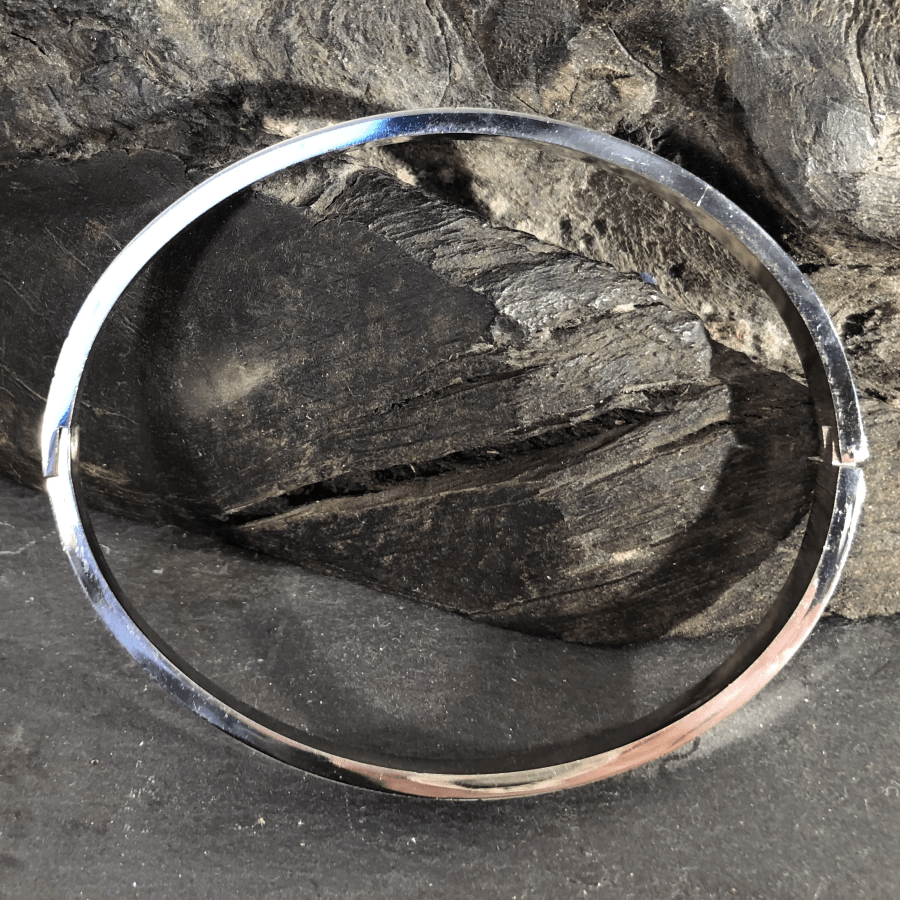 Stainless Steel Bangle Silver Coloured Oval with Jigsaw Motif