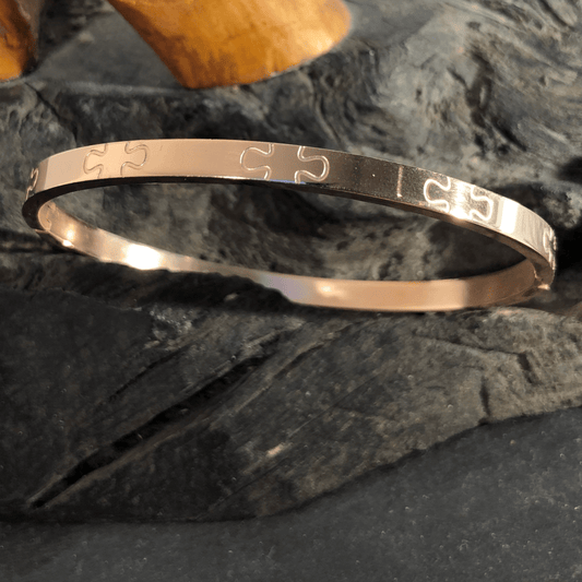 Stainless Steel Bangle Rose Gold Coloured Oval with Jigsaw Motif